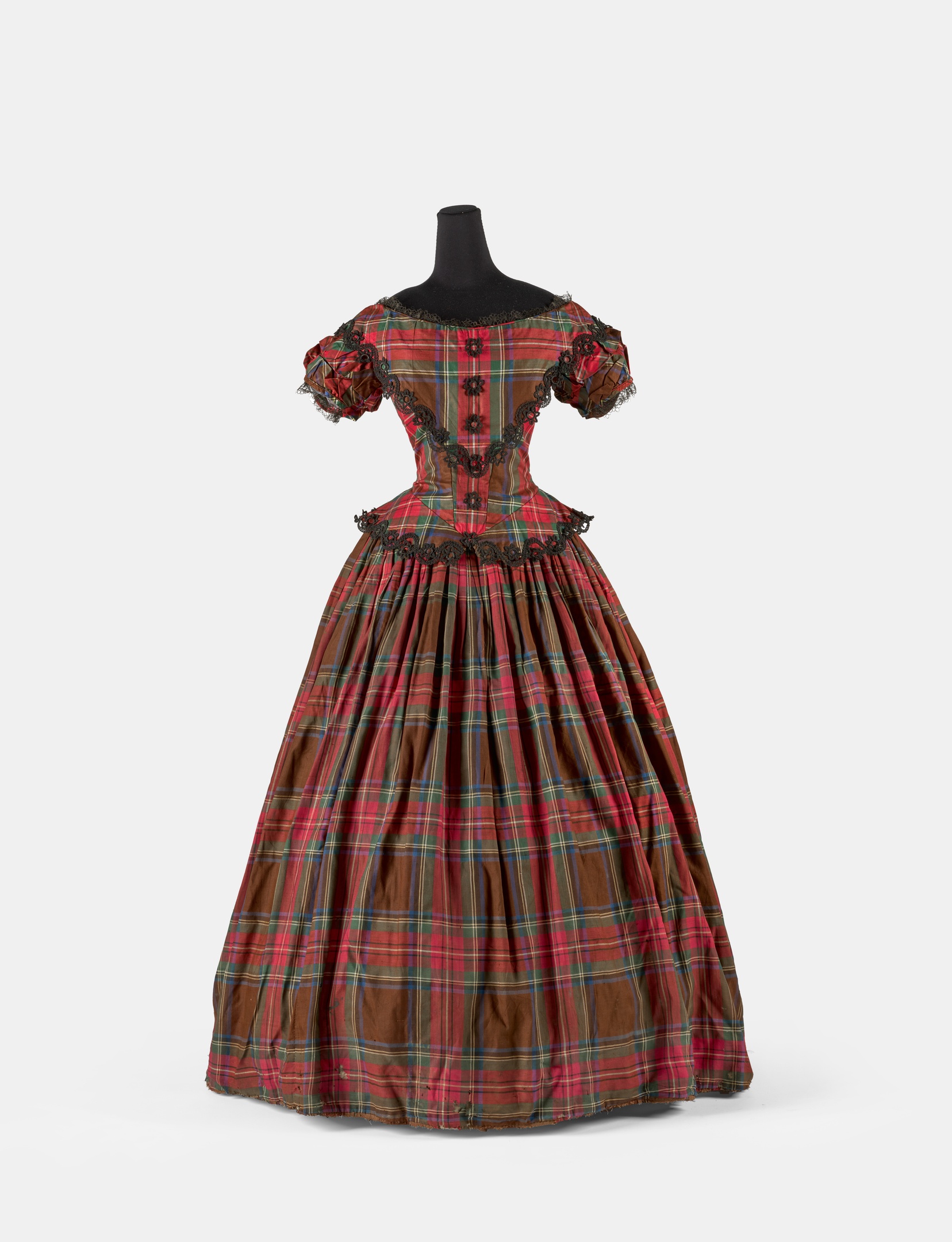 Tartan dress, worn by Mrs Josephine Geyer, 1860–65, cotton, silk, wood, metal, dimensions variable. | Photo: Courtesy of Saul Steed / AGSA